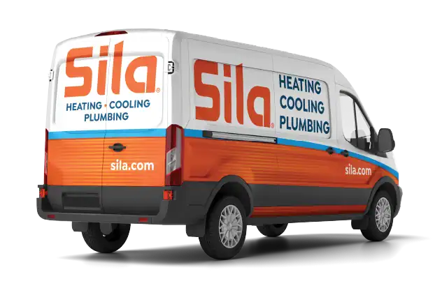 A white and orange van with "Sila Heating Cooling Plumbing," the website "sila.com," and an "about us" section printed on the sides and back.